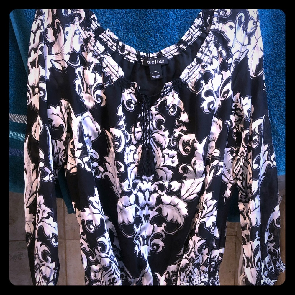 Silky black top with white fancy design